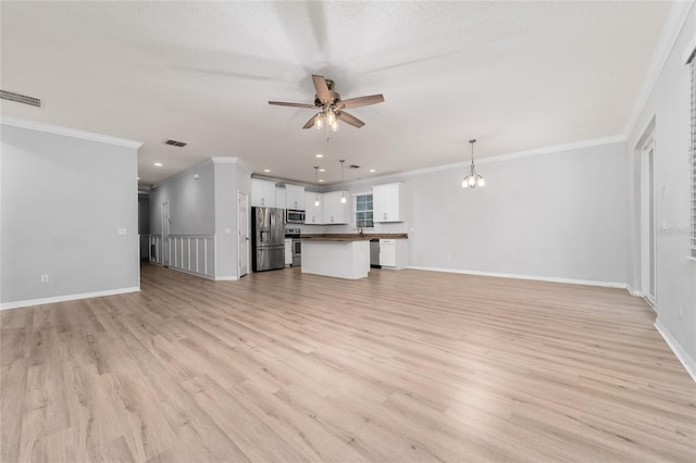 15862 Citrus Grove Loop, Winter Garden, FL 34787 - unfurnished living room featuring ceiling fan, light wood finished floors, ornamental molding, baseboards, and recessed lighting