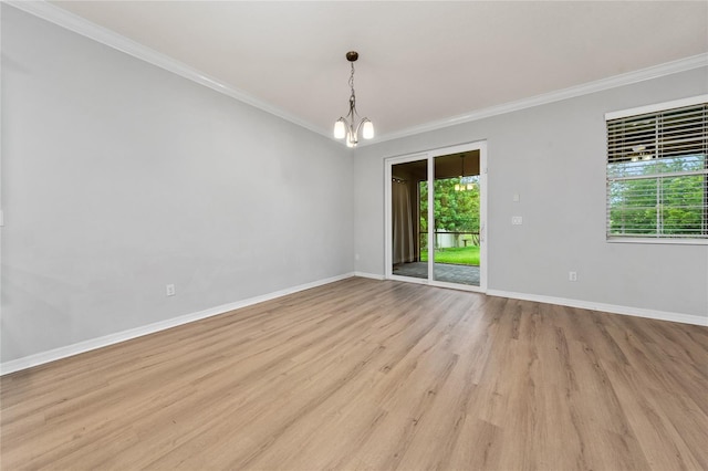 15862 Citrus Grove Loop, Winter Garden, FL 34787 - unfurnished room with crown molding, a chandelier, light wood-style floors, and baseboards