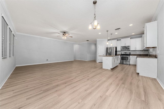 15862 Citrus Grove Loop, Winter Garden, FL 34787 - kitchen featuring stainless steel appliances, open floor plan, a center island, ceiling fan, and a chandelier