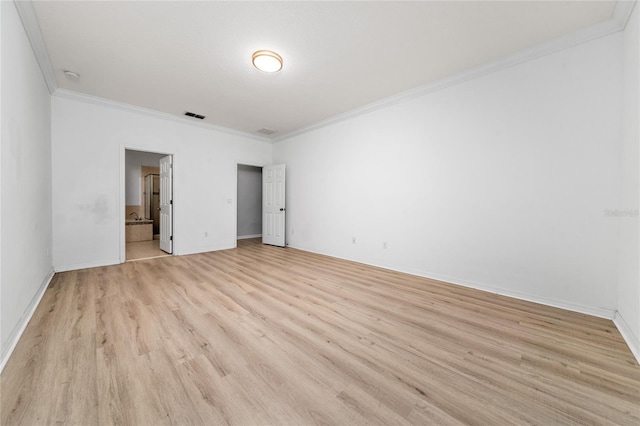 15862 Citrus Grove Loop, Winter Garden, FL 34787 - unfurnished bedroom featuring ornamental molding, light wood finished floors, baseboards, and connected bathroom