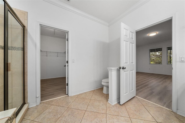 15862 Citrus Grove Loop, Winter Garden, FL 34787 - full bath featuring crown molding, a stall shower, toilet, a spacious closet, and tile patterned floors