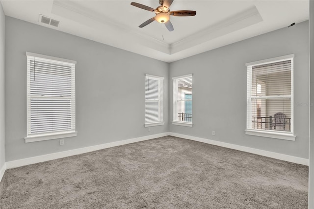 14826 Deaton Aly, Orlando, FL 32827 - carpeted spare room featuring a tray ceiling, ceiling fan, crown molding, and baseboards
