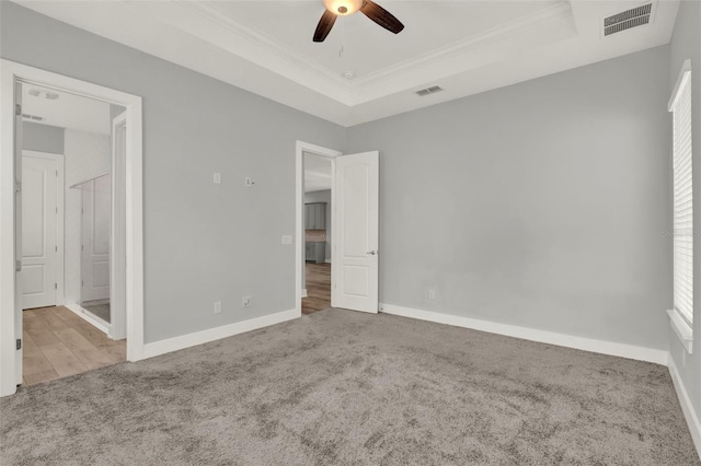 14826 Deaton Aly, Orlando, FL 32827 - unfurnished bedroom featuring carpet flooring, a raised ceiling, ornamental molding, baseboards, and a ceiling fan