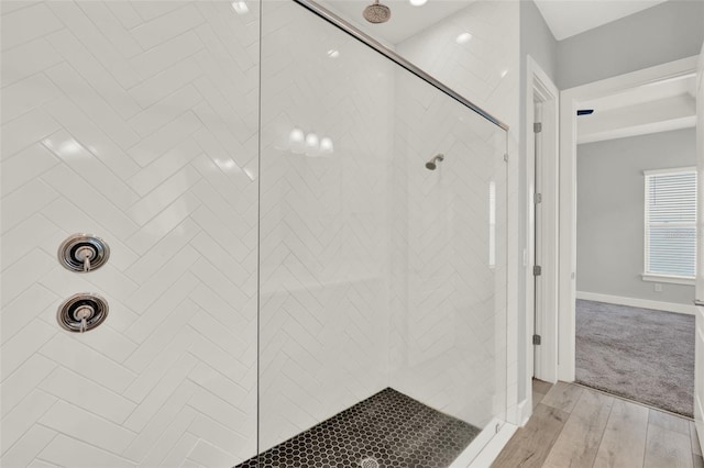14826 Deaton Aly, Orlando, FL 32827 - full bathroom with a tile shower, wood finished floors, and baseboards
