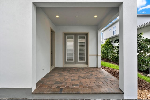 14826 Deaton Aly, Orlando, FL 32827 - entrance to property featuring french doors and stucco siding
