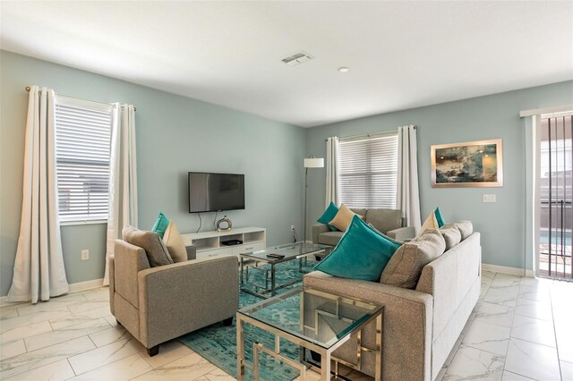 1575 Plunker Dr, Davenport, FL 33896 - living area featuring light marble finish floors