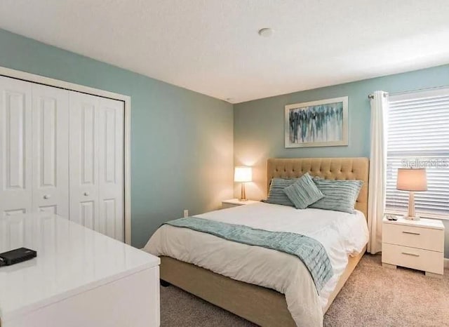 1575 Plunker Dr, Davenport, FL 33896 - bedroom with light carpet and a closet
