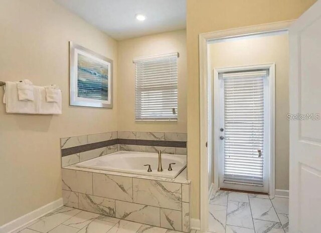 1575 Plunker Dr, Davenport, FL 33896 - full bath featuring marble finish floors, a bath, plenty of natural light, and recessed lighting