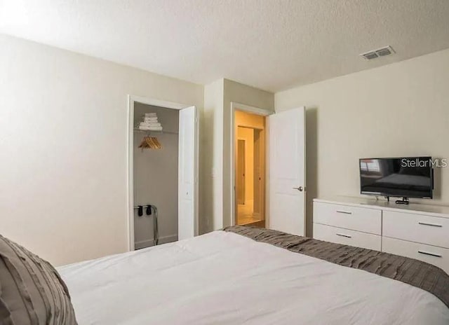 1575 Plunker Dr, Davenport, FL 33896 - bedroom with a textured ceiling