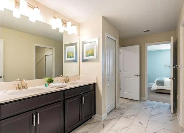 1575 Plunker Dr, Davenport, FL 33896 - ensuite bathroom with marble finish flooring and double vanity