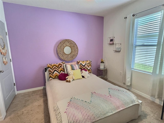 3329 Royal Tern Dr, Winter Haven, FL 33881 - bedroom featuring light carpet and baseboards