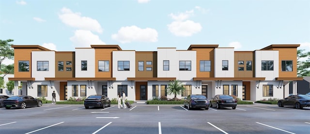 209 Breezeway Dr, Davenport, FL 33897 - view of building exterior featuring uncovered parking