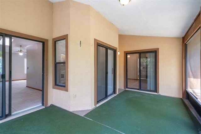 unfurnished sunroom with lofted ceiling