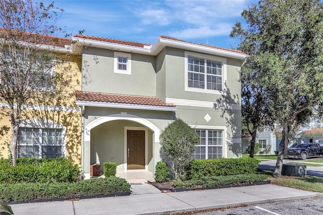 8919 Bismarck Palm Rd, Kissimmee, FL 34747 - view of front of home with a tile roof and stucco siding