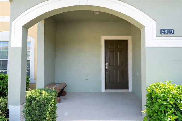 8919 Bismarck Palm Rd, Kissimmee, FL 34747 - doorway to property featuring stucco siding