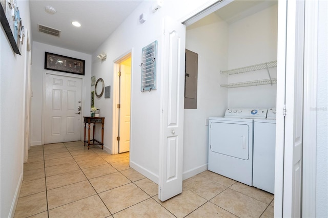 8919 Bismarck Palm Rd, Kissimmee, FL 34747 - washroom with separate washer and dryer, light tile patterned floors, electric panel, baseboards, and recessed lighting