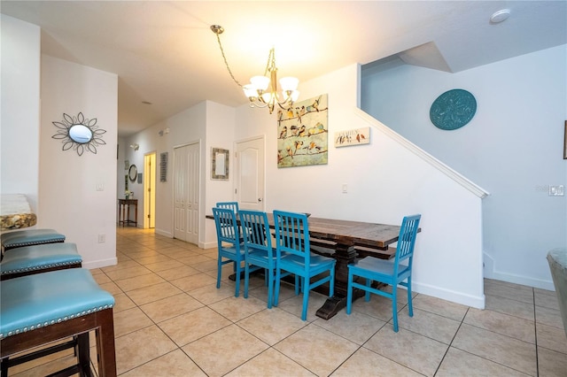 8919 Bismarck Palm Rd, Kissimmee, FL 34747 - dining room featuring a chandelier, light tile patterned floors, and baseboards