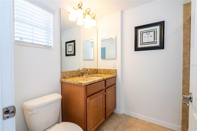 8919 Bismarck Palm Rd, Kissimmee, FL 34747 - bathroom with toilet, vanity, tile patterned floors, and baseboards