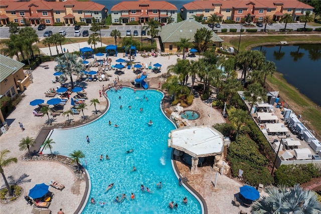 8919 Bismarck Palm Rd, Kissimmee, FL 34747 - aerial view of residential area featuring a pool and a large body of water