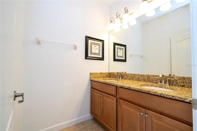 8919 Bismarck Palm Rd, Kissimmee, FL 34747 - bathroom with tile patterned flooring, double vanity, and baseboards