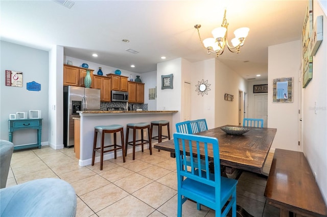 8919 Bismarck Palm Rd, Kissimmee, FL 34747 - dining space featuring a chandelier, light tile patterned flooring, and recessed lighting
