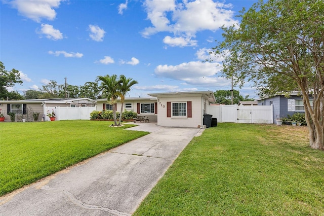 ranch-style house featuring a gate and concrete driveway