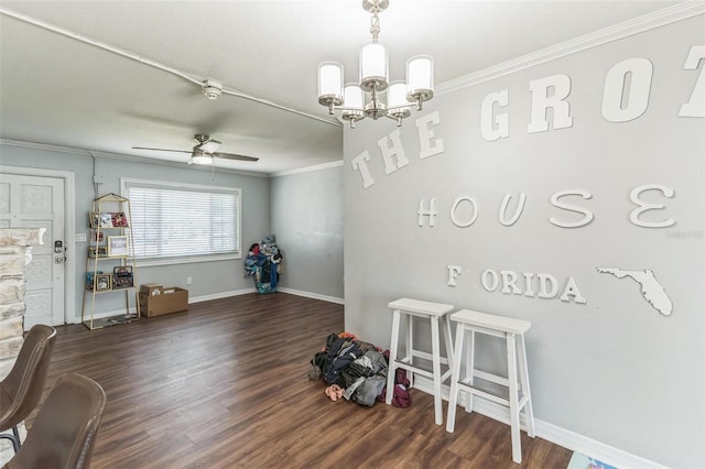 playroom with crown molding, a chandelier, wood finished floors, baseboards, and ceiling fan