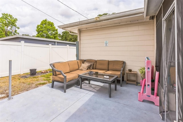view of patio / terrace with an outdoor living space and a fenced backyard