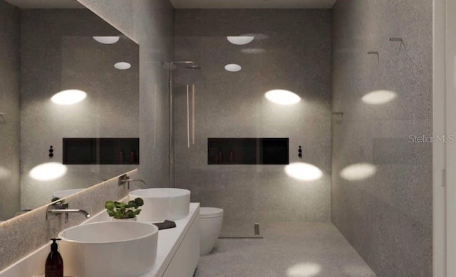 11302 Westwood Blvd Unit 28, Orlando, FL 32821 - full bath with toilet, a tile shower, and double vanity