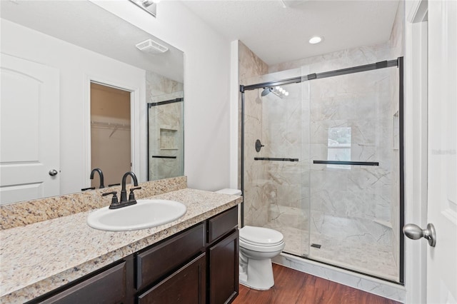 337 Southern Winds Blvd, Deland, FL 32720 - full bathroom featuring a stall shower, toilet, wood finished floors, and vanity