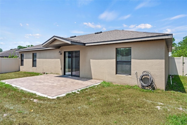337 Southern Winds Blvd, Deland, FL 32720 - rear view of property featuring stucco siding, a patio area, and roof with shingles