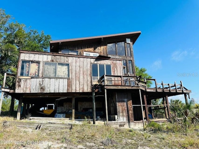 505 Lakeview Ave, Titusville, FL 32796 - rear view of house featuring a deck