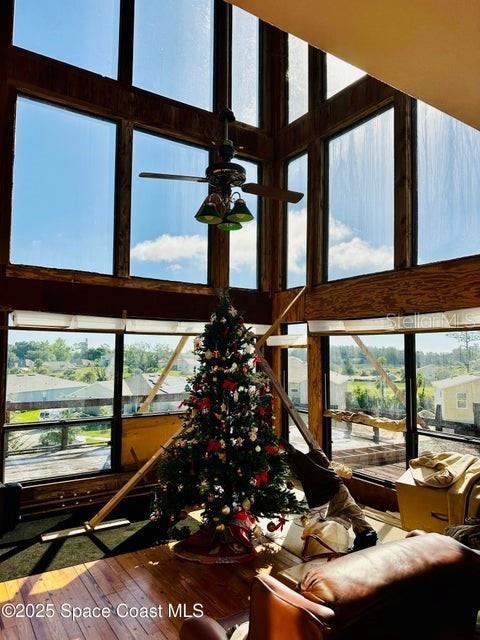 505 Lakeview Ave, Titusville, FL 32796 - living room with a high ceiling and wood finished floors
