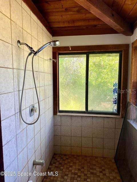505 Lakeview Ave, Titusville, FL 32796 - bathroom with wood ceiling, tiled shower, and beam ceiling