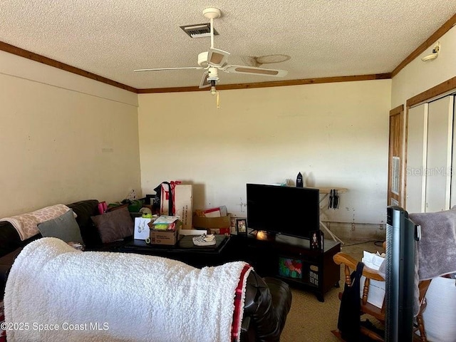 505 Lakeview Ave, Titusville, FL 32796 - living room with ornamental molding, a textured ceiling, ceiling fan, and carpet flooring