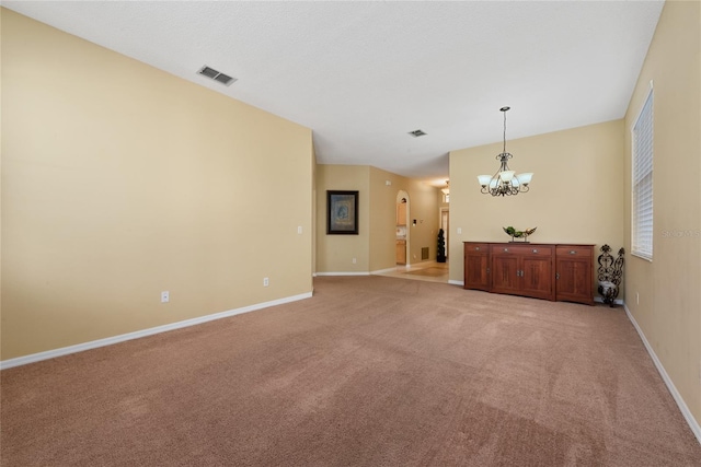 5007 Bellthorn Dr, Orlando, FL 32837 - empty room with a chandelier, light colored carpet, and baseboards