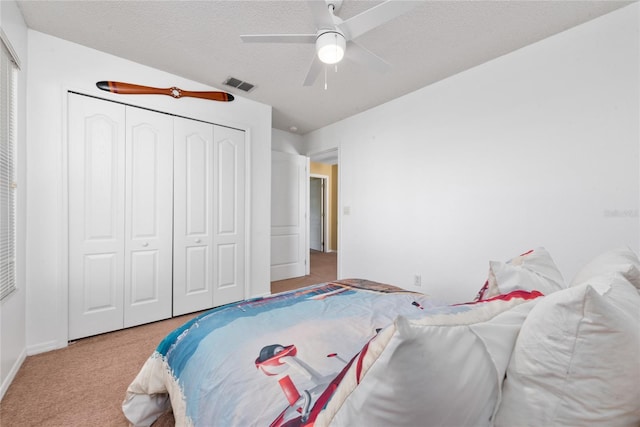 5007 Bellthorn Dr, Orlando, FL 32837 - carpeted bedroom with a closet, a ceiling fan, a textured ceiling, and baseboards
