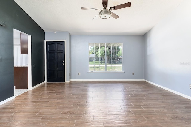 18 Palmira Rd, Debary, FL 32713 - foyer with ceiling fan, wood finished floors, baseboards, and vaulted ceiling