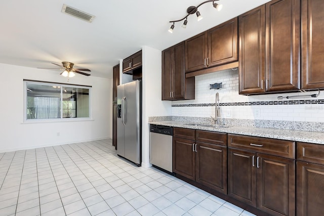 18 Palmira Rd, Debary, FL 32713 - kitchen with stainless steel appliances, a sink, ceiling fan, and tasteful backsplash