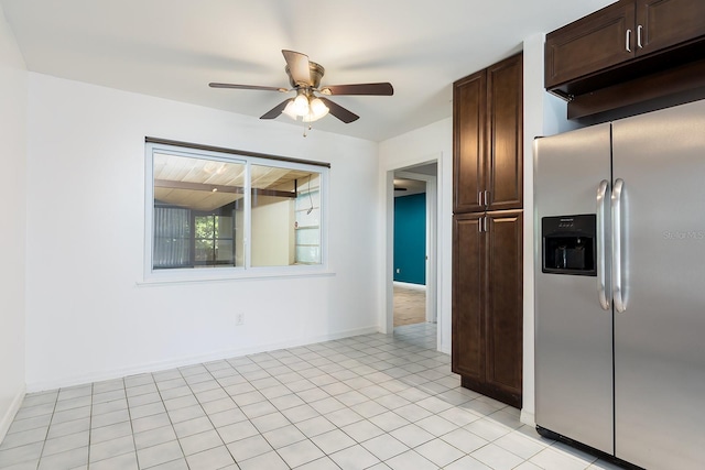 18 Palmira Rd, Debary, FL 32713 - kitchen with stainless steel fridge, ceiling fan, dark brown cabinets, baseboards, and light tile patterned flooring
