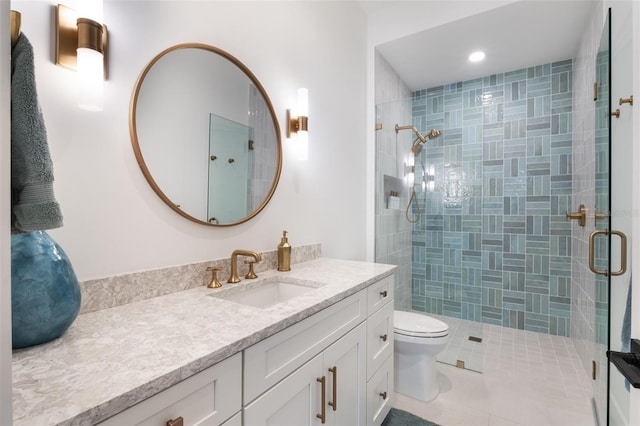 bathroom with a shower stall, vanity, toilet, tile patterned flooring, and recessed lighting