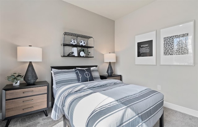 bedroom with carpet flooring and baseboards