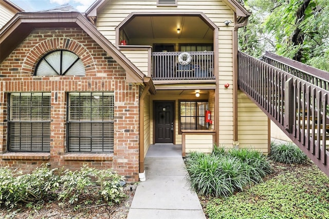 485 Forestway Cir Unit 108, Altamonte Springs, FL 32701 - doorway to property with brick siding and a balcony