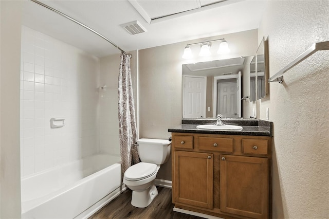 485 Forestway Cir Unit 108, Altamonte Springs, FL 32701 - bathroom with wood finished floors, toilet, a textured wall, shower / bath combination with curtain, and vanity
