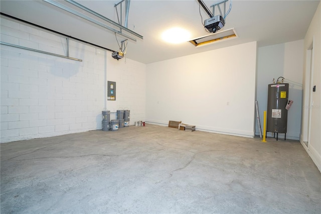 garage featuring water heater, a garage door opener, electric panel, and concrete block wall