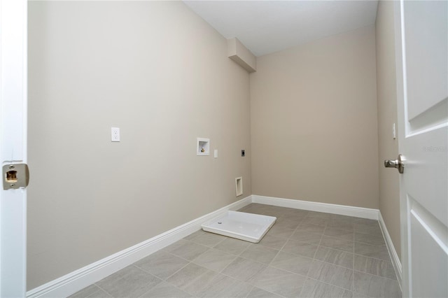 laundry area with electric dryer hookup, washer hookup, baseboards, and light tile patterned flooring