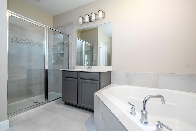 full bath with a stall shower, a bath, vanity, and tile patterned floors