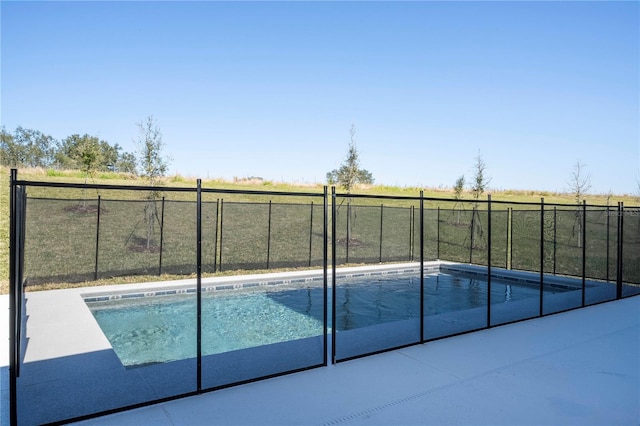 view of pool featuring fence