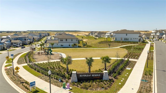 view of community featuring a residential view and fence