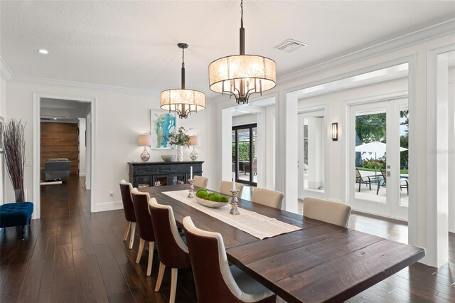 1455 Kelso Blvd, Windermere, FL 34786 - dining room featuring a chandelier, dark wood-type flooring, baseboards, ornamental molding, and recessed lighting